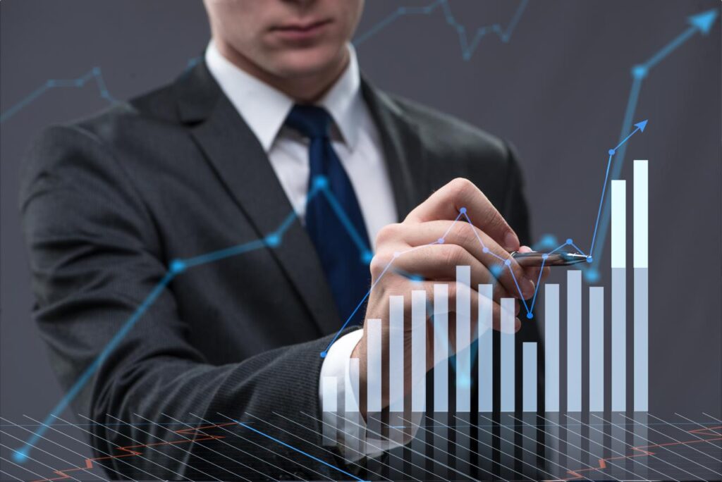 A manager highlights trends in a graph using technology