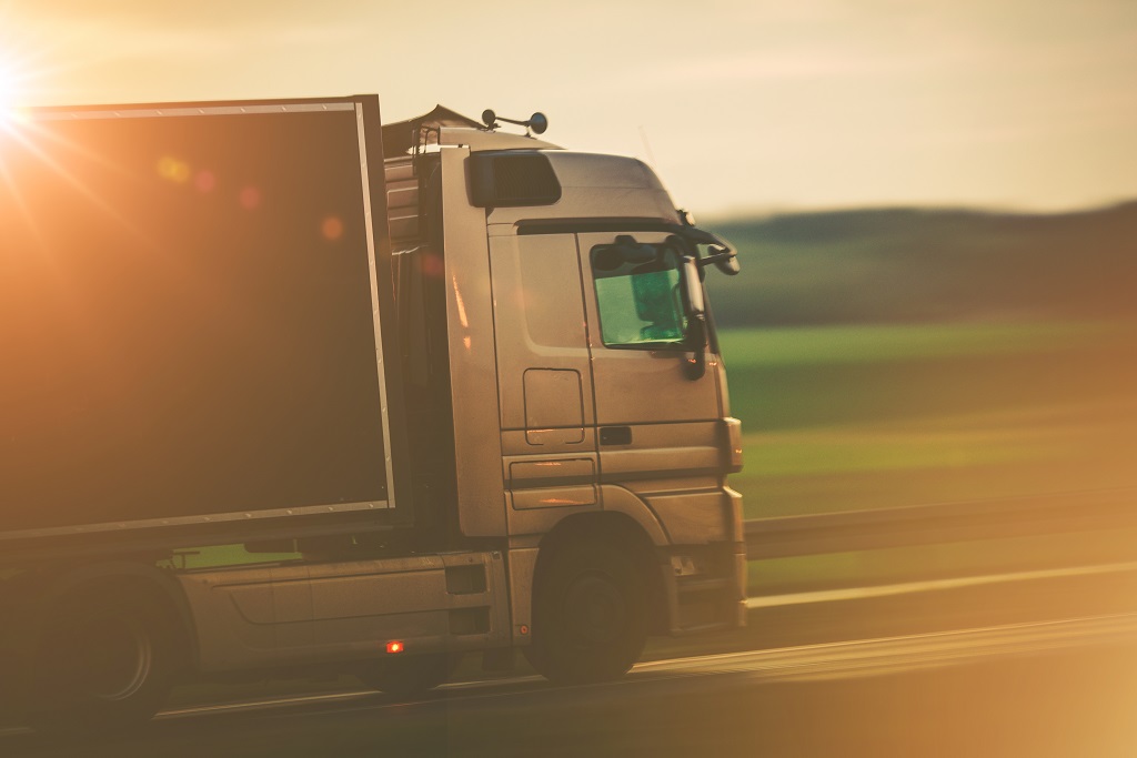 A truck transports items as part of a wider logisitcs chain.
